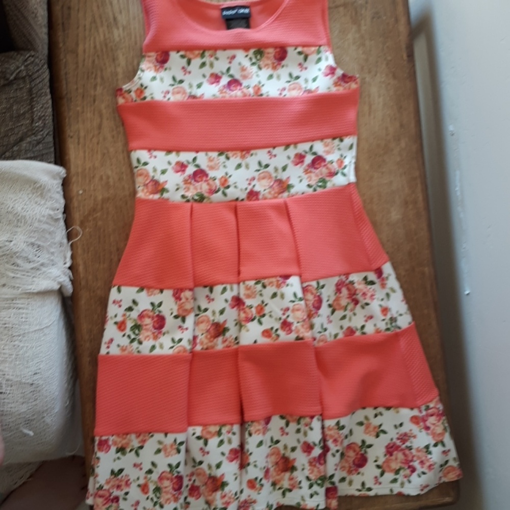 A kids pink dress with flowers